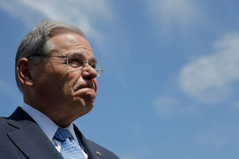 U.S. Sen. Bob Menendez fields questions about his upcoming trial in which he is facing federal corruption charges after completing a flood insurance news conference, Thursday, Aug. 17, 2017, in Union Beach, N.J. (AP Photo/Julio Cortez)
