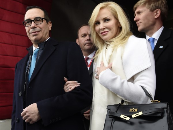 Treasury Secretary-designate Stephen Mnuchin and his fiancee Louise Linton arrive on Capitol Hill in Washington, Friday, Jan. 20, 2017, for the presidential inauguration of Donald Trump. (Saul Loeb/Pool Photo via AP)