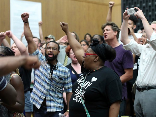 Emotions run high during the Charlottesville City Council meeting Monday night in Charlottesville, Va. Photo/Andrew Shurtleff/The Daily Progress