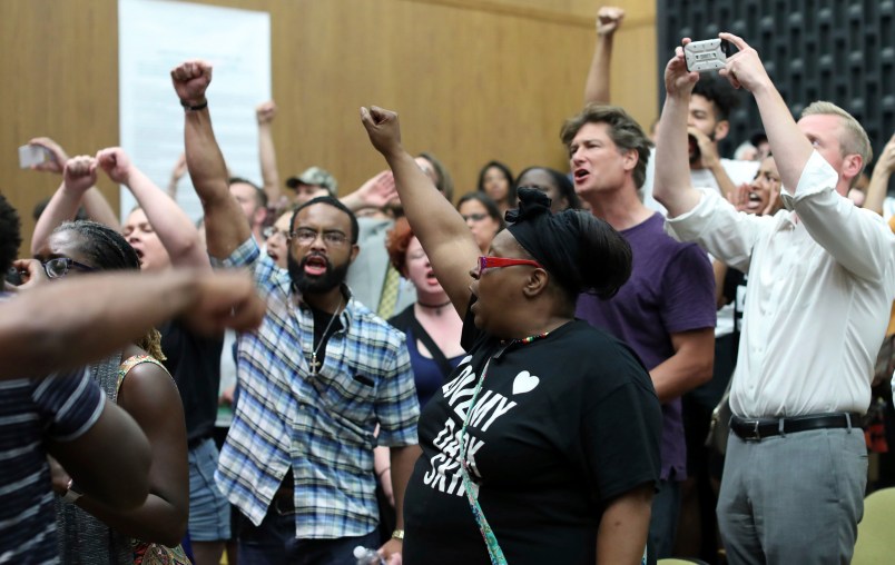 Emotions run high during the Charlottesville City Council meeting Monday night in Charlottesville, Va. Photo/Andrew Shurtleff/The Daily Progress