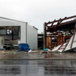 A cyclist passes buildings damaged in the wake of Hurricane Harvey, Saturday, Aug. 26, 2017, in Rockport, Texas. (AP Photo/Eric Gay)