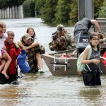 Residents are rescued from their homes surrounded by floodwaters from Tropical Storm Harvey Sunday, Aug. 27, 2017, in Houston, Texas. (AP Photo/David J. Phillip)
