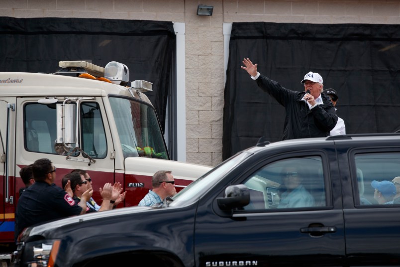 President Donald Trump talks with supporters outside Firehouse 5 where he received a briefing on Hurricane Harvey relief efforts, Tuesday, Aug. 29, 2017, in Corpus Christi, Texas. (AP Photo/Evan Vucci)