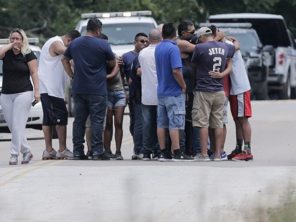 Family members react as a van is pulled out of the Greens Bayou with the bodies of six family members on Wednesday, Aug. 30, 2017, in Houston. The van was carried into the bayou during Tropical Storm Harvey as the water went over the bridge.  ( Elizabeth Conley / Houston Chronicle )
