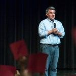 Republican Sen. Cory Gardner of Colorado speaks at a town hall as guests hold red "disagree" and green "agree" cards Tuesday, Aug. 15, 2017, at Pikes Peak Community College in Colorado Springs, Colo.