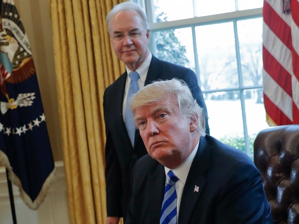 President Donald Trump with Health and Human Services Secretary Tom Price, listens after addressing members of the media regarding the health care overhaul bill, Friday, March 24, 2017, in the Oval Office of the White House in Washington. (AP Photo/Pablo Martinez Monsivais)