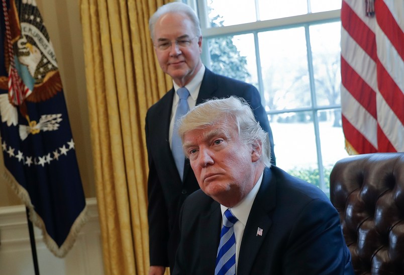 President Donald Trump with Health and Human Services Secretary Tom Price, listens after addressing members of the media regarding the health care overhaul bill, Friday, March 24, 2017, in the Oval Office of the White House in Washington. (AP Photo/Pablo Martinez Monsivais)