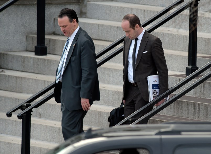 Trump deputy chief of staff for policy, Rick Dearborn, left, and senior policy adviser Stephen Miller, right, walk down the steps of the Eisenhower Executive Office Building on the White House complex in Washington, Friday, Jan. 13, 2017, following a meeting. (AP Photo/Susan Walsh)