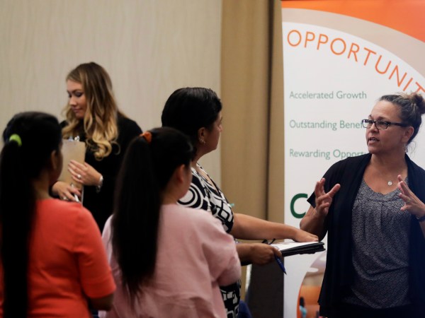 ***ATTN Swayne Hall *** Kathy Tringali, at right, a recruiter for retailer Big 5 talks to job seekers during a job fair Thursday, Aug. 24, 2017, in San Jose, Calif. (AP Photo/Marcio Jose Sanchez)