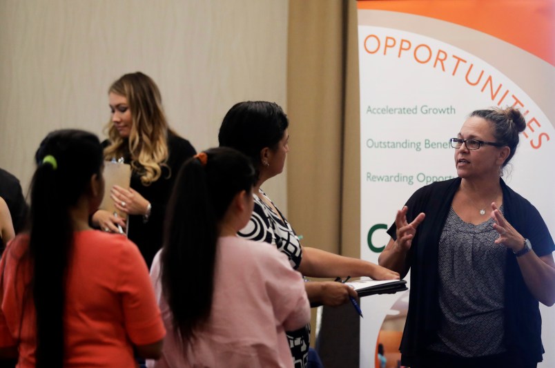 ***ATTN Swayne Hall *** Kathy Tringali, at right, a recruiter for retailer Big 5 talks to job seekers during a job fair Thursday, Aug. 24, 2017, in San Jose, Calif. (AP Photo/Marcio Jose Sanchez)