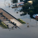 People launch boats into floodwaters from an overpass on Hwy 287 in the aftermath of Tropical Storm Harvey in Kountze, Texas, Thursday, Aug. 31, 2017. (AP Photo/Gerald Herbert)