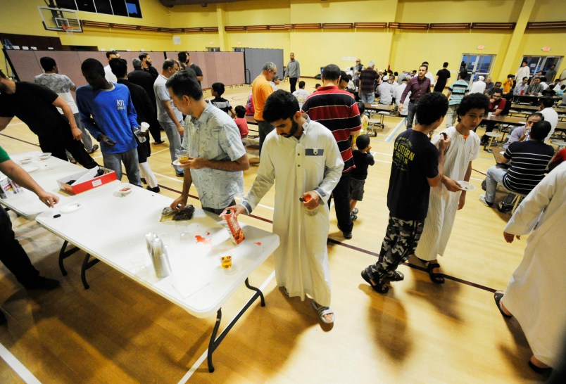 Muslims at Champions Mosque gather for a meal at an Islamic holy day celebration on Thursday, Aug. 31, 2017. Houston’s Muslim community, estimated to be at least 50,000 people, has opened many of its community centers and sent hundreds of volunteers to serve food and deliver donations. (AP Photo/Jay Reeves)