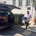 Workers carry boxes out of the Russian consulate in San Francisco as acrid, black smoke was seen pouring from a chimney at the stately building in a historic area of the city Friday, Sept. 1, 2017, a day after the Trump administration ordered its closure amid escalating tensions between the United States and Russia. The workers were hurrying to shut Russia's oldest consulate in the U.S. ahead of a Saturday deadline. (AP Photo/Garance Burke)
