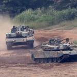 South Korean army's K-1 tanks move during a military exercise in Paju, South Korea, Tuesday, Sept. 5, 2017.  South Korean warships conducted live-fire exercises at sea Tuesday as Seoul continued its displays of military capability following U.S. warnings of a "massive military response" after North Korea detonated its largest-ever nuclear test explosion. (AP Photo/Lee Jin-man)