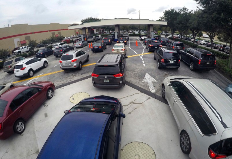 Drivers wait in line for gasoline at the Costco in Altamonte Springs, Fla., ahead of the anticipated arrival of Hurricane Irma,  Wednesday, Sept. 6, 2017. (Joe Burbank/Orlando Sentinel)  3017048