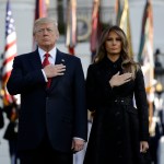 President Donald Trump and first lady Melania Trump stand for a moment of silence to mark the anniversary of the Sept. 11 terrorist attacks, on the South Lawn of the White House, Monday, Sept. 11, 2017, in Washington. (AP Photo/Evan Vucci)