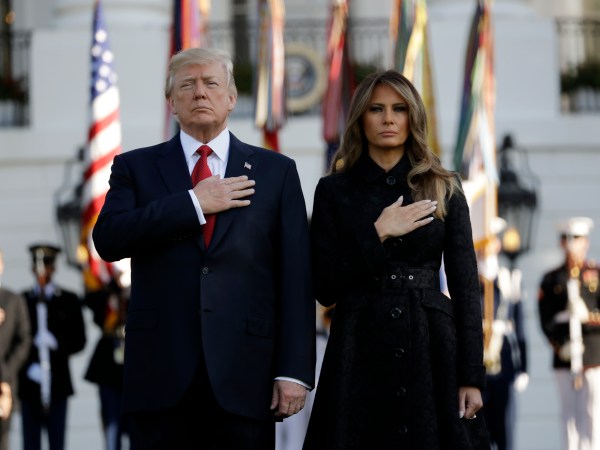 President Donald Trump and first lady Melania Trump stand for a moment of silence to mark the anniversary of the Sept. 11 terrorist attacks, on the South Lawn of the White House, Monday, Sept. 11, 2017, in Washington. (AP Photo/Evan Vucci)