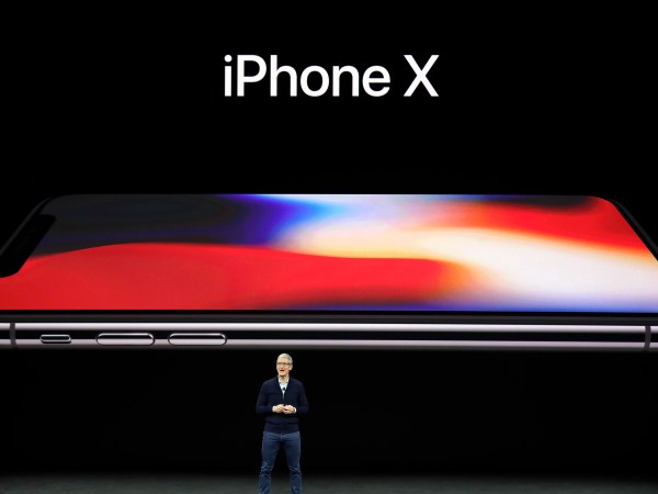 Apple CEO Tim Cook, announces the new iPhone X at the Steve Jobs Theater on the new Apple campus on Tuesday, Sept. 12, 2017, in Cupertino, Calif. (AP Photo/Marcio Jose Sanchez)