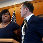 Missouri Gov. Eric Greitens, right, and Christina Wilson, the fiancée of Anthony Lamar Smith, deliver a statement in anticipation of a verdict in the trial of former St. Louis police officer Jason Stockley Thursday, Sept. 14, 2017, in St. Louis. Stockley is accused in the 2011 killing of Lamar Smith following a high-speed chase. (AP Photo/Jeff Roberson)