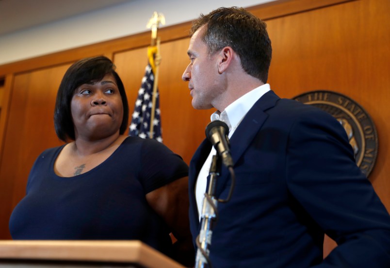 Missouri Gov. Eric Greitens, right, and Christina Wilson, the fiancée of Anthony Lamar Smith, deliver a statement in anticipation of a verdict in the trial of former St. Louis police officer Jason Stockley Thursday, Sept. 14, 2017, in St. Louis. Stockley is accused in the 2011 killing of Lamar Smith following a high-speed chase. (AP Photo/Jeff Roberson)