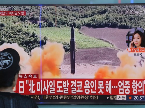 A woman watches a TV screen showing a file footage of North Korea's missile launch, at the Seoul Railway Station in Seoul, South Korea, Friday, Sept. 15, 2017. South Korea's military said North Korea fired an unidentified missile Friday from its capital Pyongyang that flew over Japan before landing in the northern Pacific Ocean. The signs read "Japan protests North Korea's missile launch" (AP Photo/Ahn Young-joon)