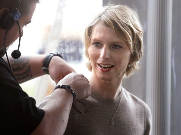 Chelsea Manning, right, is assisted with a microphone, Sunday, Sept. 17, 2017, before a scheduled appearance at a forum, in Nantucket, Mass. The planned forum is part of The Nantucket Project's annual gathering on the island of Nantucket. Manning is a former U.S. Army intelligence analyst who spent seven years in prison for sharing classified documents. (AP Photo/Steven Senne)