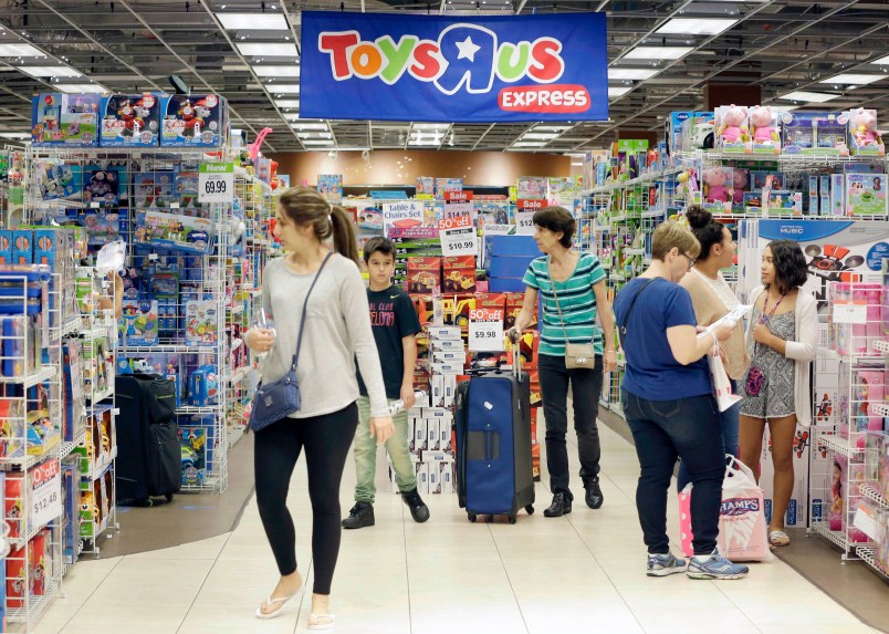 Shoppers shop in a Toys R Us store on Black Friday, Nov. 25, 2016, in Miami. Stores open their doors Friday for what is still one of the busiest days of the year, even as the start of the holiday season edges ever earlier. (AP Photo/Alan Diaz)