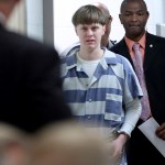 FILE - In this Monday, April 10, 2017, file photo, Dylann Roof enters the court room at the Charleston County Judicial Center to enter his guilty plea on murder charges in Charleston, S.C. Federal officials are for the first time showing videos of convicted the South Carolina church shooter's jailhouse visits with his family on Tuesday, May 16. (Grace Beahm/The Post And Courier via AP, Pool, File)