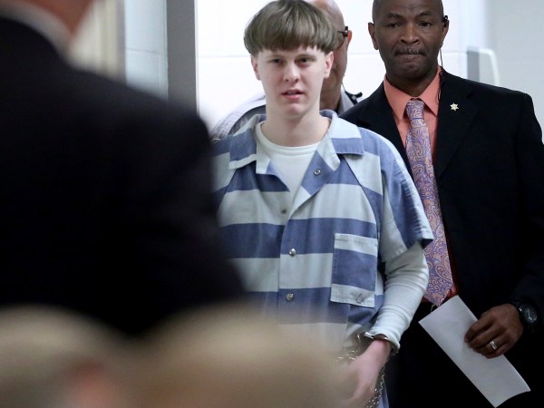 FILE - In this Monday, April 10, 2017, file photo, Dylann Roof enters the court room at the Charleston County Judicial Center to enter his guilty plea on murder charges in Charleston, S.C. Federal officials are for the first time showing videos of convicted the South Carolina church shooter's jailhouse visits with his family on Tuesday, May 16. (Grace Beahm/The Post And Courier via AP, Pool, File)