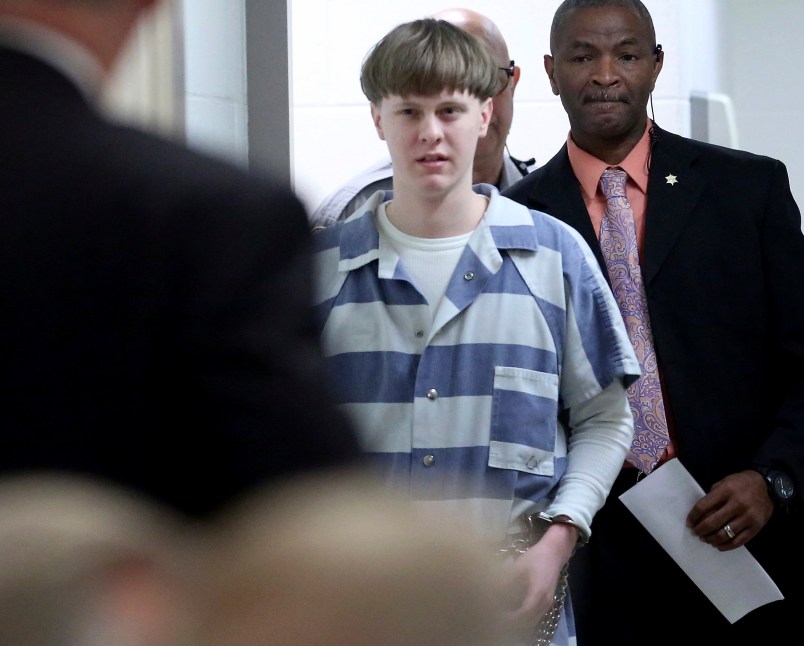 FILE - In this Monday, April 10, 2017, file photo, Dylann Roof enters the court room at the Charleston County Judicial Center to enter his guilty plea on murder charges in Charleston, S.C. Federal officials are for the first time showing videos of convicted the South Carolina church shooter's jailhouse visits with his family on Tuesday, May 16. (Grace Beahm/The Post And Courier via AP, Pool, File)