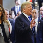 President Donald Trump, center, with first lady Melania Trump, left, speaks to media as he leaves following his address to the United Nations General Assembly, Tuesday Sept. 19, 2017 at U.N. headquarters. (AP Photo/Bebeto Matthews)