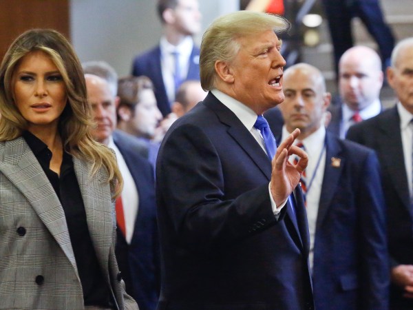 President Donald Trump, center, with first lady Melania Trump, left, speaks to media as he leaves following his address to the United Nations General Assembly, Tuesday Sept. 19, 2017 at U.N. headquarters. (AP Photo/Bebeto Matthews)
