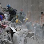 at a building that collapsed after an earthquake in Mexico City, Mexico, Thursday, Sept. 21, 2017.Tuesday's magnitude 7.1 earthquake has stunned central Mexico, killing more than 200 people as buildings collapsed in plumes of dust.(AP Photo/Natacha Pisarenko)