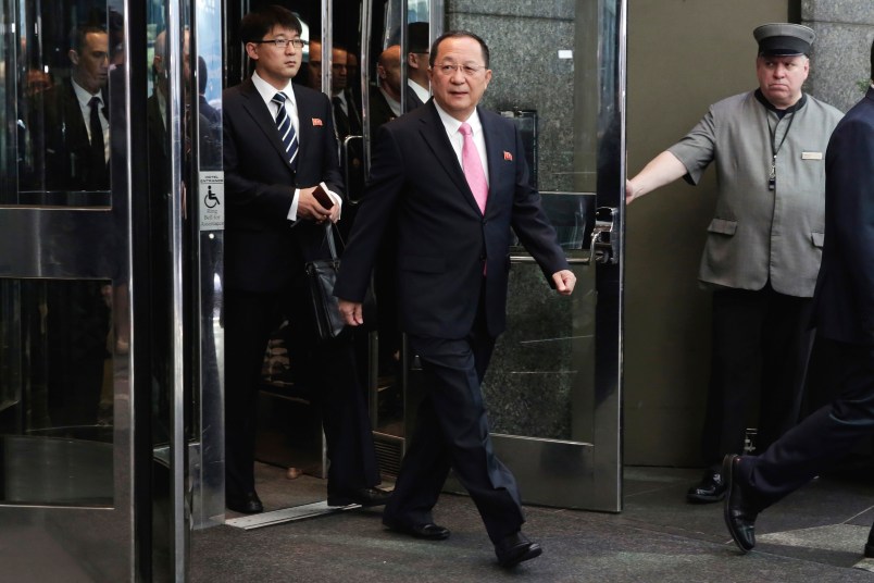 North Korea's Foreign Minister Ri Yong Ho, center, followed by his interpreter, left, walks to the microphones to speak outside the U.N. Plaza Hotel, in New York, Monday, Sept. 25, 2017. (AP Photo/Richard Drew)
