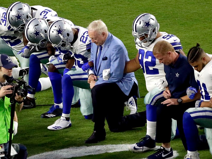 The Dallas Cowboys, led by owner Jerry Jones, center, take a knee prior to the national anthem prior to an NFL football game against the Arizona Cardinals, Monday, Sept. 25, 2017, in Glendale, Ariz. (AP Photo/Matt York)