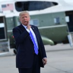President Donald Trump responds to a reporter's question on health care after arriving at John F. Kennedy International Airport in New York, Tuesday, Sept. 26, 2017. Trump is in New York to meet with major GOP donors for a private dinner as part of a fundraising effort for the Republican National Committee. (AP Photo/Susan Walsh)