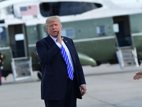 President Donald Trump responds to a reporter's question on health care after arriving at John F. Kennedy International Airport in New York, Tuesday, Sept. 26, 2017. Trump is in New York to meet with major GOP donors for a private dinner as part of a fundraising effort for the Republican National Committee. (AP Photo/Susan Walsh)