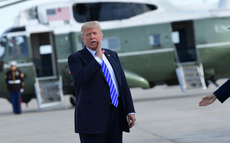 President Donald Trump responds to a reporter's question on health care after arriving at John F. Kennedy International Airport in New York, Tuesday, Sept. 26, 2017. Trump is in New York to meet with major GOP donors for a private dinner as part of a fundraising effort for the Republican National Committee. (AP Photo/Susan Walsh)