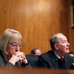 Senate Health, Education, Labor, and Pensions Committee Chairman Sen. Lamar Alexander, R-Tenn., accompanied by the committee's ranking member Sen. Patty Murray, D-Wash. speaks on Capitol Hill in Washington, Tuesday, Jan. 31, 2017, during the committee's executive session to discuss the nomination of Education Secretary Betsy DeVos.  (AP Photo/Alex Brandon)