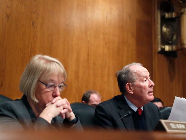 Senate Health, Education, Labor, and Pensions Committee Chairman Sen. Lamar Alexander, R-Tenn., accompanied by the committee's ranking member Sen. Patty Murray, D-Wash. speaks on Capitol Hill in Washington, Tuesday, Jan. 31, 2017, during the committee's executive session to discuss the nomination of Education Secretary Betsy DeVos.  (AP Photo/Alex Brandon)