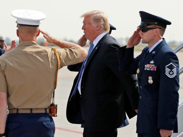 President Donald Trump is saluted as he steps off Air Force One, Wednesday, Sept. 27, 2017, in Indianapolis, Ind. (AP Photo/Alex Brandon)