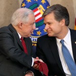 FBI Director Christopher A. Wray is welcomed at a ceremony at the FBI Building, Thursday, Sept. 28, 2017, in Washington. Also in attendance is Attorney General Jeff Sessions. (AP Photo/Andrew Harnik)