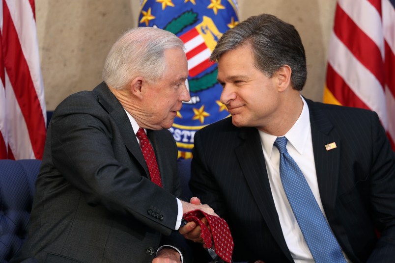 FBI Director Christopher A. Wray is welcomed at a ceremony at the FBI Building, Thursday, Sept. 28, 2017, in Washington. Also in attendance is Attorney General Jeff Sessions. (AP Photo/Andrew Harnik)