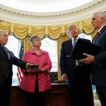 President Donald Trump watches as Vice President Mike Pence administers the oath of office to Attorney General Jeff Sessions, accompanied by his wife Mary, Thursday, Feb. 9, 2017, in the Oval Office of the White House in Washington. (AP Photo/Pablo Martinez Monsivais)