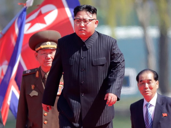 North Korean leader Kim Jong Un, second right, is accompanied by Pak Pong Ju, right, Hwang Pyong So, second left, and Choe Ryong Hae, left, as he arrives for the official opening of the Ryomyong residential area, a collection of more than a dozen apartment buildings, on Thursday, April 13, 2017, in Pyongyang, North Korea. (AP Photo/Wong Maye-E)