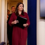 White House press secretary Sarah Huckabee Sanders arrives for the daily press briefing, Thursday, Aug. 31, 2017, in Washington. (AP Photo/Evan Vucci)