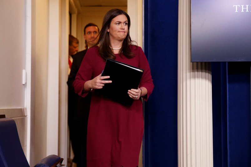 White House press secretary Sarah Huckabee Sanders arrives for the daily press briefing, Thursday, Aug. 31, 2017, in Washington. (AP Photo/Evan Vucci)