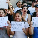 Supporters of the Deferred Action for Childhood Arrivals, or DACA chant slogans and holds signs while joining a Labor Day rally in downtown Los Angeles on Monday, Sept. 4, 2017. (AP Photo/Richard Vogel)