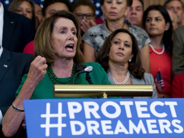 House Minority Leader Nancy Pelosi of Calif. accompanied by members of the House and Senate Democrats, gestures during a news conference on Capitol Hill in Washington, Wednesday, Sept. 6, 2017. House and Senate Democrats gather to call for Congressional Republicans to stand up to President Trump's decision to terminate the Deferred Action for Childhood Arrivals (DACA) initiative by bringing the DREAM Act for a vote on the House and Senate Floor. ( AP Photo/Jose Luis Magana)