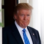 President Donald Trump waits outside the West Wing of the White House for the arrival of Malaysian Prime Minister Najib Razak, Tuesday, Sept. 12, 2017, in Washington. (AP Photo/Evan Vucci)